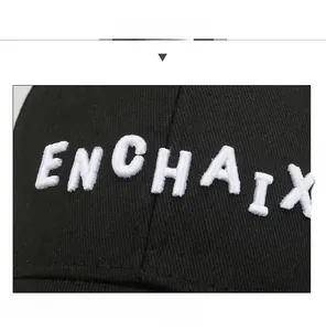 Macro shot of high-quality dense embroidery on a black twill fabric baseball cap
