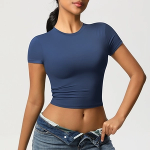 Detail of slim fit navy blue crop top yoga shirt with high-elasticity fabric texture