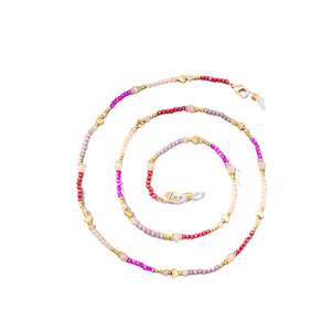 Colorful crystal beaded eyewear chain with gold heart accents for women on white background