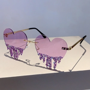 Detail of purple heart-shaped rimless sunglasses with cascading rhinestone water drop charms