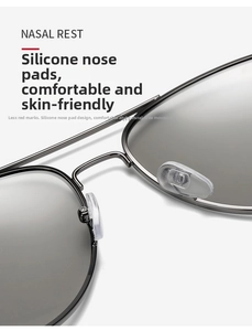 Macro shot of adjustable soft silicone nose pads on metallic aviator sunglasses