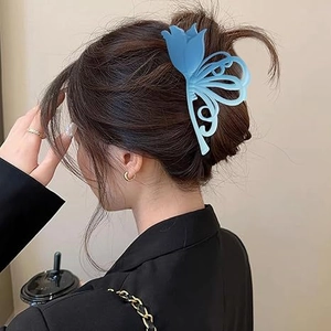 Blue gradient tulip hair claw clip shown on a model's hair for an elegant updo