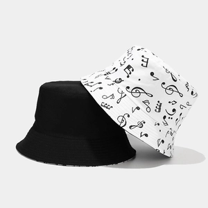 Reversible bucket hat for women and men featuring music note print in black and white canvas