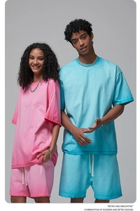 Detail of drop-shoulder oversized T-shirt and drawstring shorts set in blue and pink