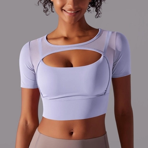 Close-up of lavender yoga top with hollow-out chest design and sheer mesh patchwork detail