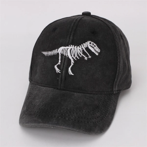 Close-up of a black washed cotton baseball cap featuring a white T-Rex skeleton embroidery