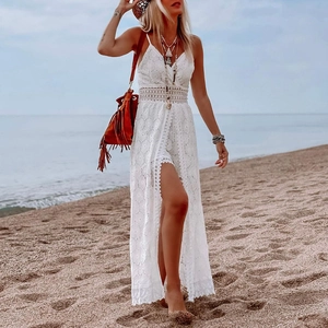 Detail of white bohemian lace dress with V-neck and hollow embroidery for summer vacation