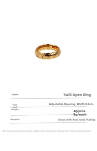 Detailed macro view showing the twisted wave texture of this gold plated brass ring