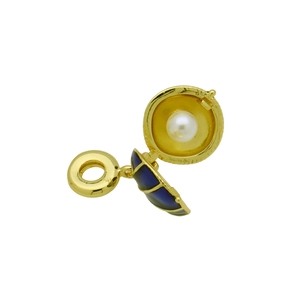 Detailed view of an openable gold shell pendant with dark blue enamel and a white pearl