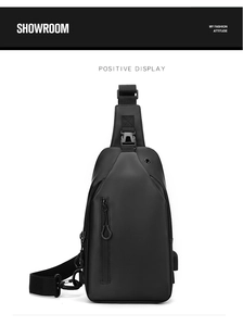 Close-up of waterproof matte texture and external USB charging port on black chest bag