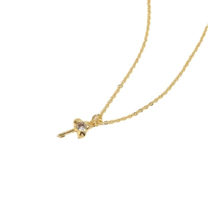 Golden necklace with a zircon-encrusted key pendant shown on a clean white background