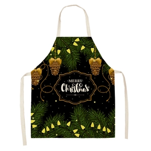 Detail of Christmas apron with pine cones, fairy lights and Merry Christmas text