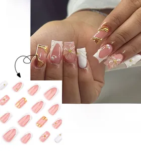 Detailed view of square press on nails with 3D floral accents, pearls, and French tips