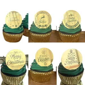 Set of 6 golden acrylic Christmas cupcake toppers with festive laser-engraved designs