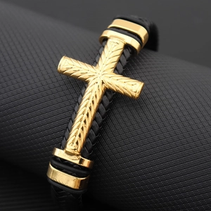 Fashionable black braided leather cross bracelet with gold metal accents for men