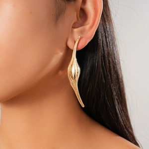 Chic gold irregular geometric curved statement earrings for women in studio lighting