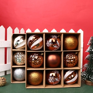 Detail of glittery gold and bronze Christmas ornaments in a 12-slot brown divider box