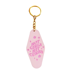Retro pink acrylic hotel-style keychain with Hot Girls Hit Curbs text and gold ring