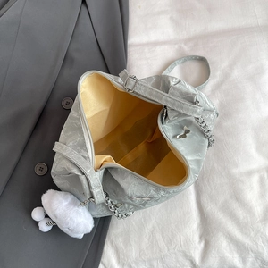 Chic light gray pleated shoulder bag with yellow lining and metal chain strap detail