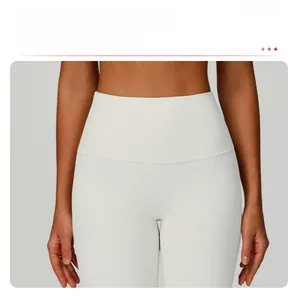 Close-up of high-waist ribbed yoga pants featuring a slimming tummy control waistband