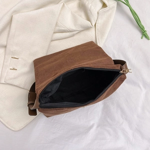 Brown matte suede crossbody bag with zipper closure and gold hardware for women