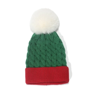 Kids green and red knit Christmas beanie with white pompom and cable stitch pattern