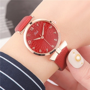 Women's quartz watch with red dial and rose gold bow-knot case on a leather strap
