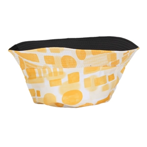 Detail of reversible sun hat showing yellow and white geometric patterns and black lining