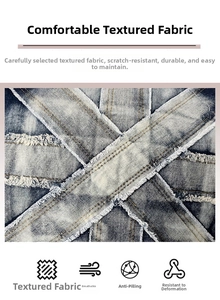 Detailed macro view of heavy denim fabric with frayed edges and cross-patchwork texture