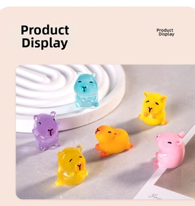 Detailed view of colorful translucent resin capybara figurines in blue yellow and pink