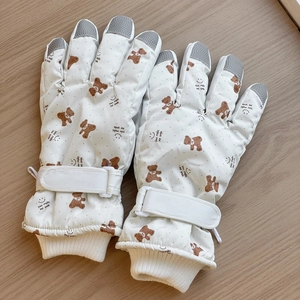 Detail of cute bear ski gloves with touchscreen fingertips and adjustable wrist straps