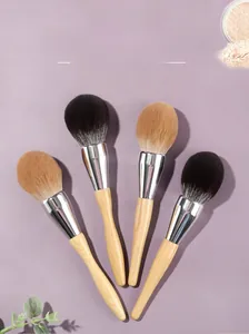 Detail of four large wooden handle powder brushes with soft bionic synthetic bristles