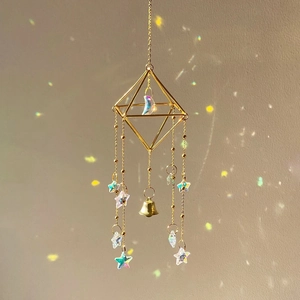 Golden geometric crystal suncatcher with rainbow star moon prisms and metal bell
