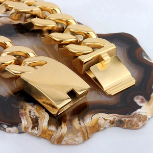 Close-up of gold-plated stainless steel Cuban link chain with square clasp detail