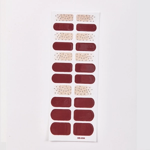 Detail view of SS-034 nail stickers featuring dark red and beige gold glitter designs