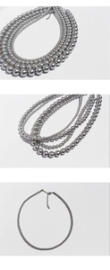 Close-up of silver-grey pearl necklace with adjustable lobster clasp and polished finish