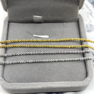 Sparkling S925 sterling silver bracelets in gold and silver finish on velvet tray
