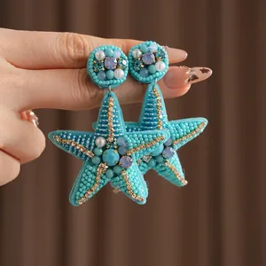 Luxury handmade starfish drop earrings with turquoise beads and sparkling crystals