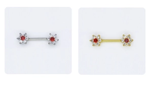 Detailed macro view of zircon flower nipple rings in silver and gold stainless steel