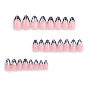 Sparkling pink almond press-on nails with black glitter French tips and aurora rhinestones