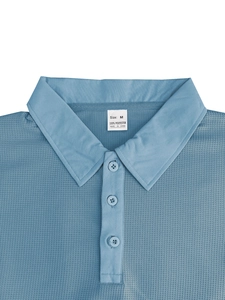 Close-up of the polo shirt collar showing the waffle texture and size M fabric label