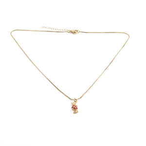 Close-up of a gold-plated lollipop pendant necklace with red and white enamel finish