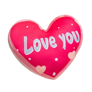 Red heart-shaped plush pillow with Love you text and small heart patterns on white background