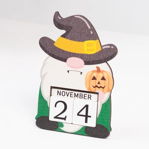 Detail of wooden Halloween countdown calendar featuring a gnome and pumpkin blocks