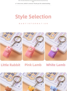 Detailed close-up of cute cartoon animal silicone stapler keychains in various soft colors