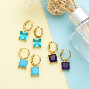 Detailed macro view of square gemstone drop earrings in blue, turquoise, and purple colors