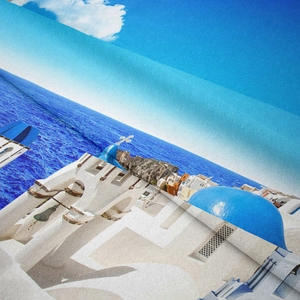 Close-up of bohemian Santorini landscape tapestry fabric showing soft texture and digital print