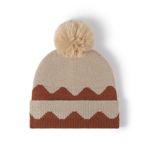Women's warm knit beanie with beige and brown color-blocking and faux fur pom-pom