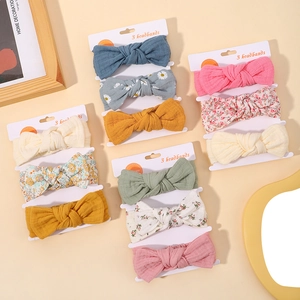 Three-piece floral cotton baby bow headbands set in assorted colors on display cards