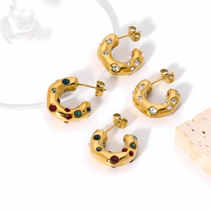 Detail view of gold-plated stainless steel C-shape earrings with colorful crystals